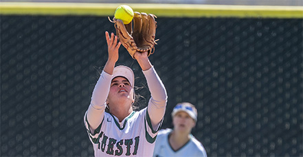 Softball player catching ball