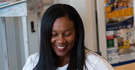 Woman seated looking down