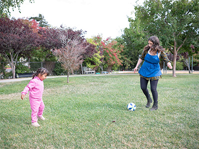 child playing soccer