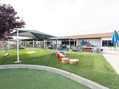 toddler outdoor play yard with grass