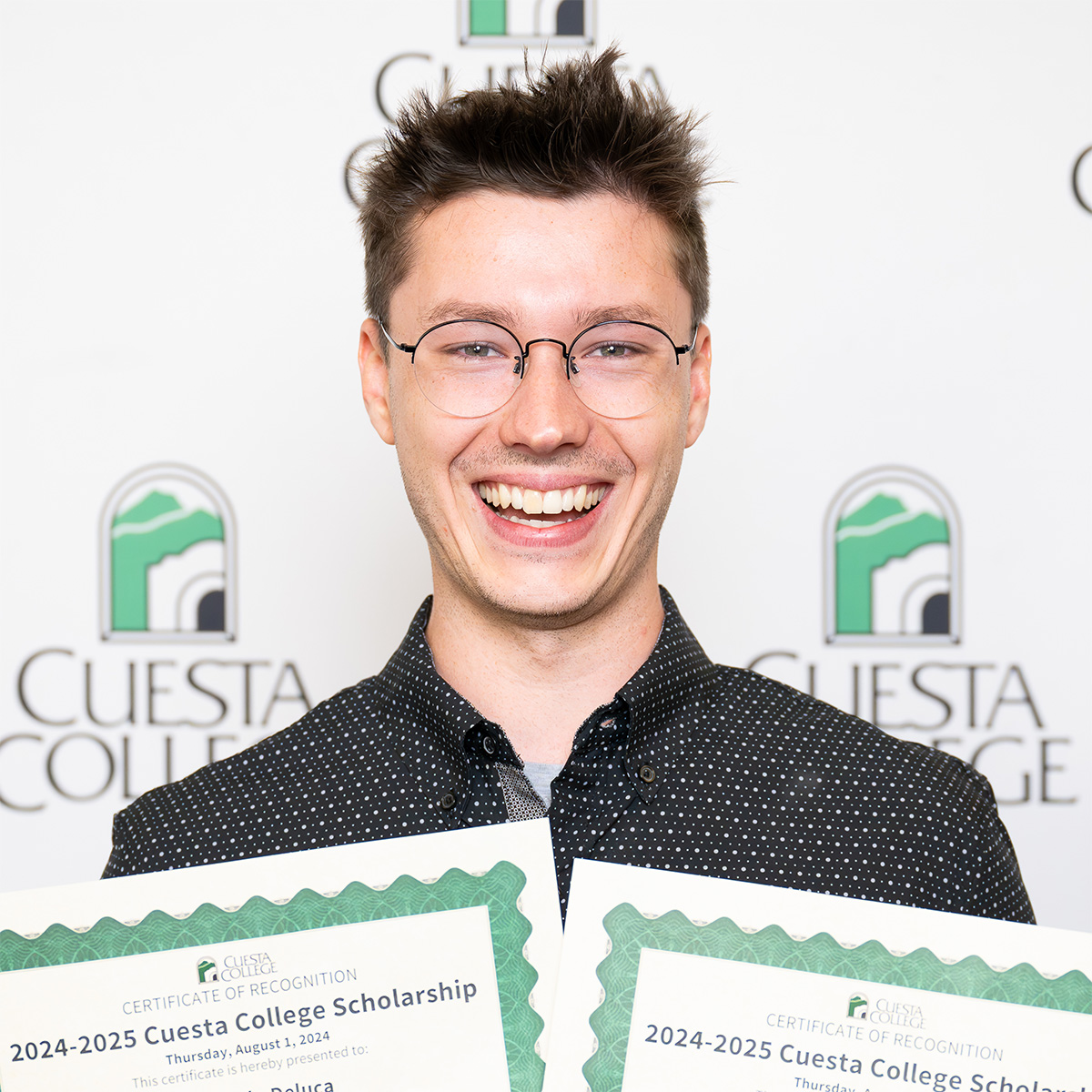 Student holding scholarships